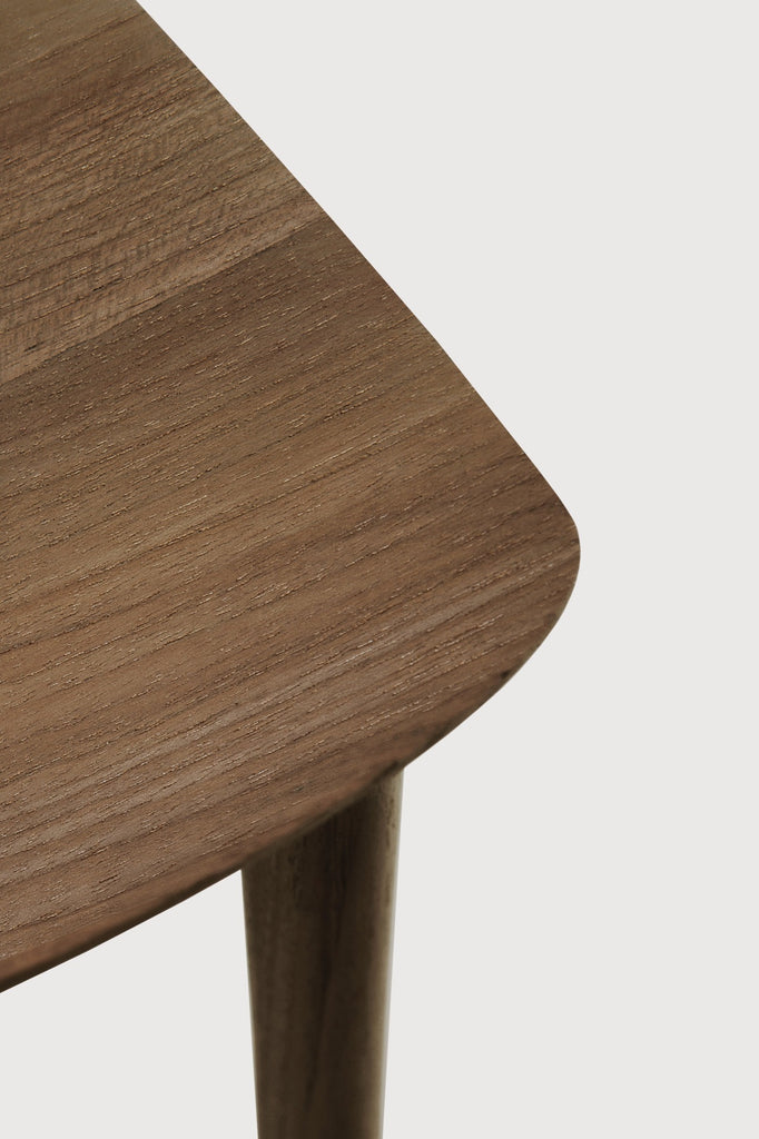 Natural Teak Bok Dining Chair detail with white background and beautiful wood joinery. - Saffron and Poe, Ethnicraft
