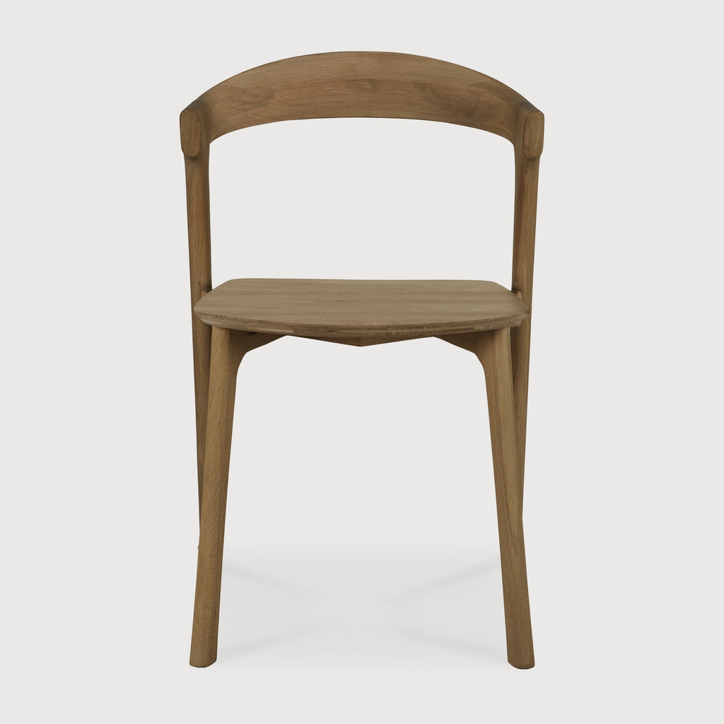 Natural Teak Bok Dining Chair front view with white background and beautiful wood joinery. - Saffron and Poe, Ethnicraft