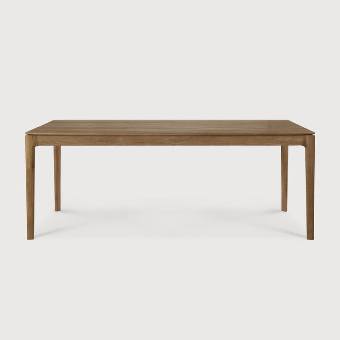 Teak Bok Dining Table side view with white background, featuring floating table top and beautiful wood joinery. - Saffron and Poe, Ethnicraft