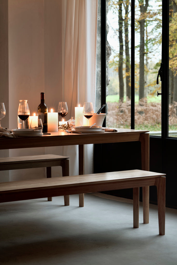 Natural Teak Bok Bench, Bok dining table in candle lit dining room. - Saffron and Poe, Ethnicraft