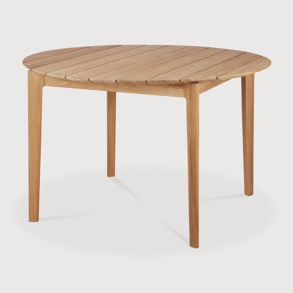 Bok Outdoor Dining Table Round angled view with white background and beautiful wood joinery. - Saffron and Poe, Ethnicraft