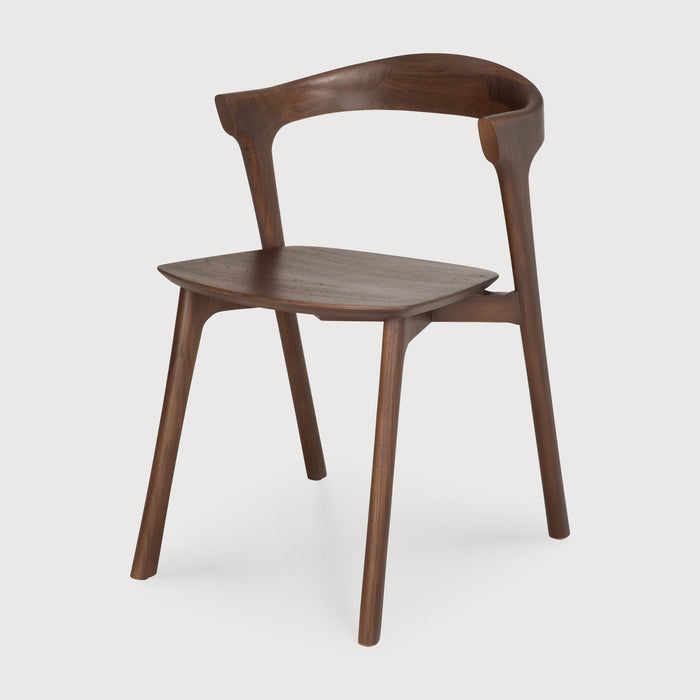 Dark Teak Bok Dining Chair angle view with white background and beautiful wood joinery. - Saffron and Poe, Ethnicraft