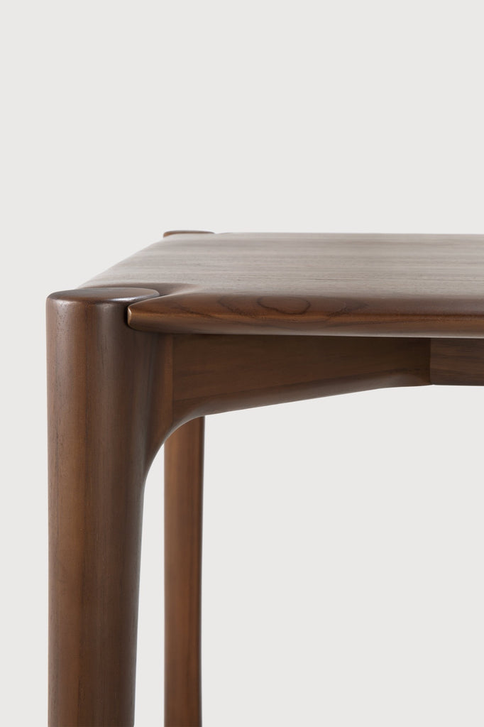 Dark Teak PI Dining Table detail with white background and beautiful wood joinery. - Saffron and Poe, Ethnicraft