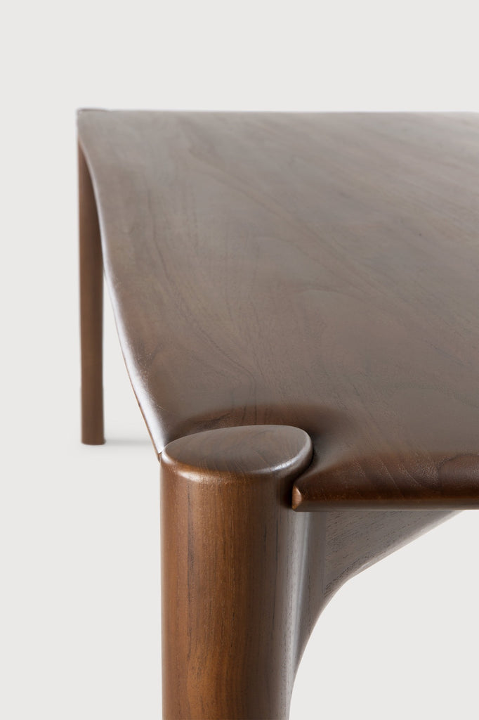 Dark Teak PI Dining Table detail with white background and beautiful wood joinery. - Saffron and Poe, Ethnicraft