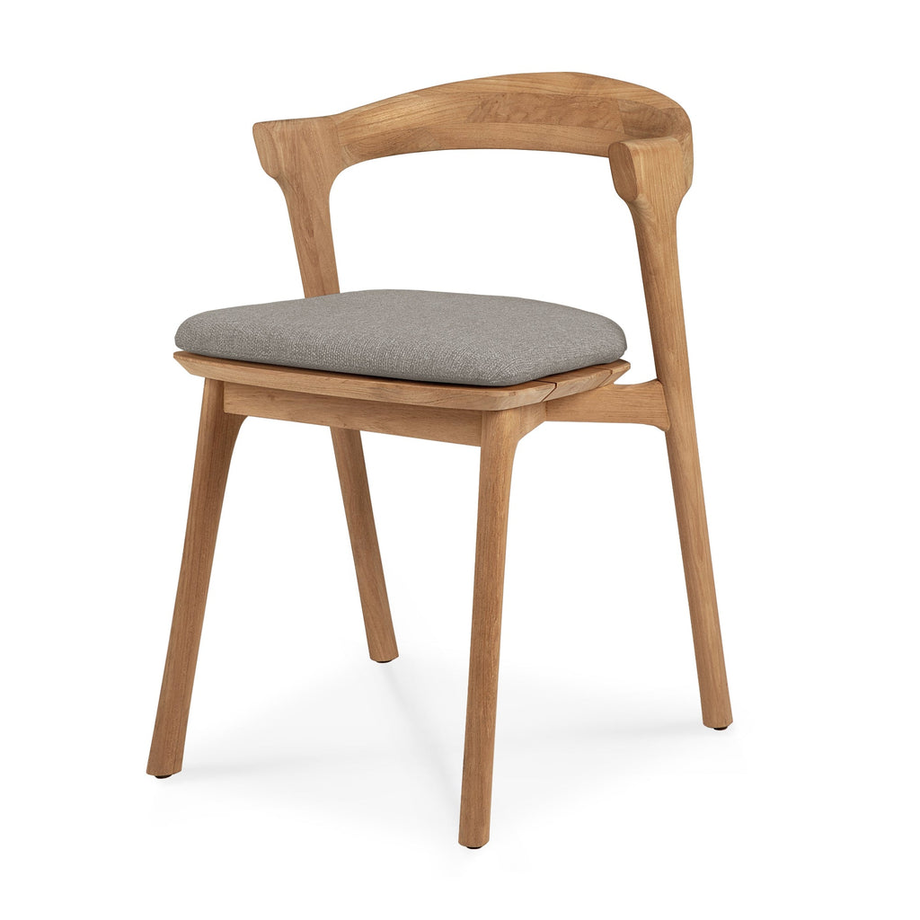 Teak Bok Outdoor Dining Chair angle view with mocha cushion on a white background and beautiful wood joinery. - Saffron and Poe, Ethnicraft