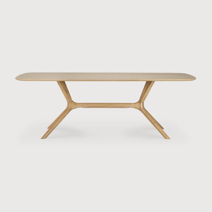 White Oak X Dining Table front angle with white background and beautiful intersecting wood legs. - Saffron and Poe, Ethnicraft