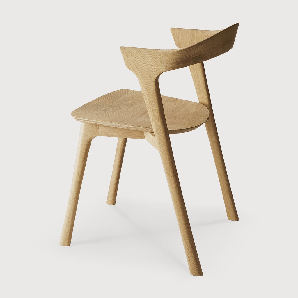 White Oak Bok Dining Chair back angle view with white background and beautiful wood joinery. - Saffron and Poe, Ethnicraft