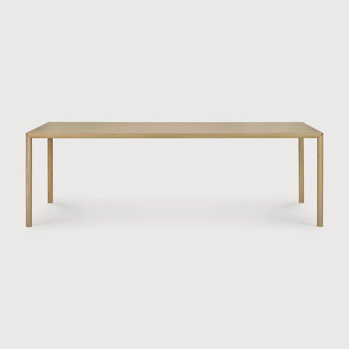 White Oak Air Dining Table front angle with white background and beautiful wood detailing. - Saffron and Poe, Ethnicraft