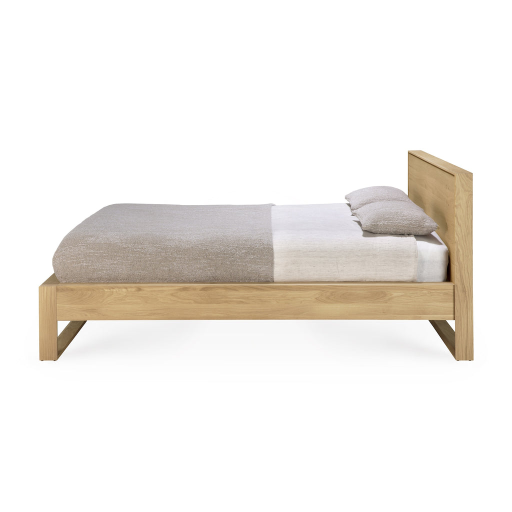 Solid European oak wood bed frame with solid wood headboard and beautiful wood joinery - side View - Saffron and Poe, Ethnicraft