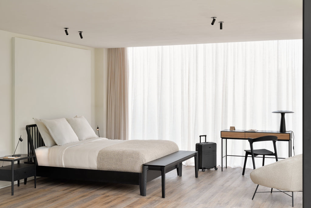 Black Oak Bok Bench and spindle bed in bright modern bedroom with sheer curtains and soft colors. - Saffron and Poe, Ethnicraft