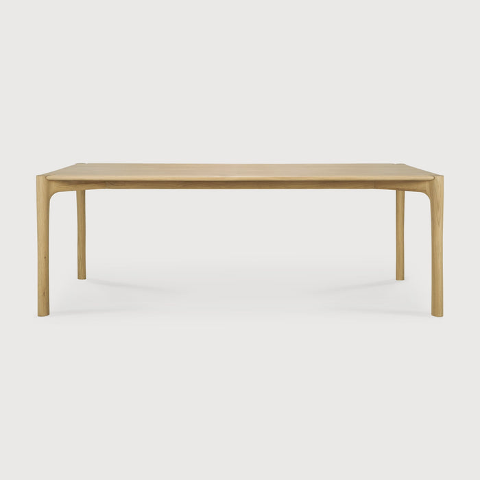 White Oak PI Dining Table front angle with white background and beautiful wood joinery. - Saffron and Poe, Ethnicraft