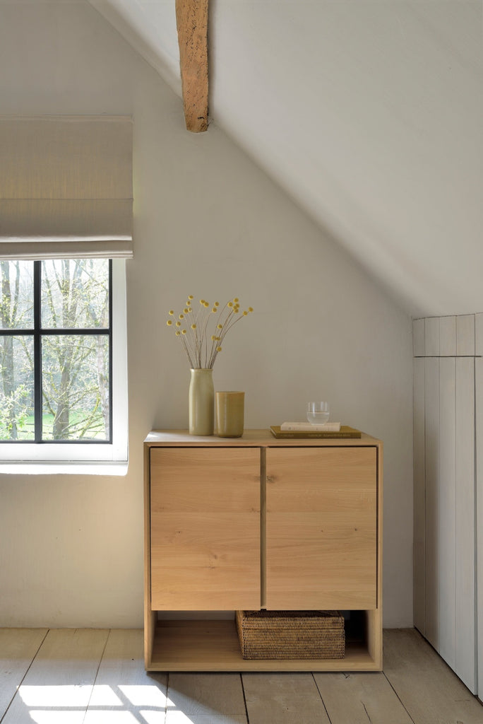 White Oak 2 door Nordic Sideboard Console in plastered modern bedroom with slanted ceilings, antique wood flooring and exposed beams. - Saffron and Poe, Ethnicraft
