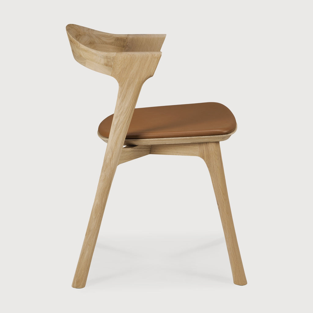 White Oak Bok Dining Chair with saddle leather seat side view with white background - Saffron and Poe, Ethnicraft