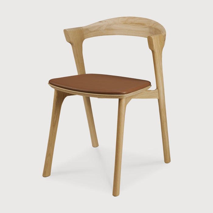 White Oak Bok Dining Chair with saddle leather seat angle view with white background - Saffron and Poe, Ethnicraft
