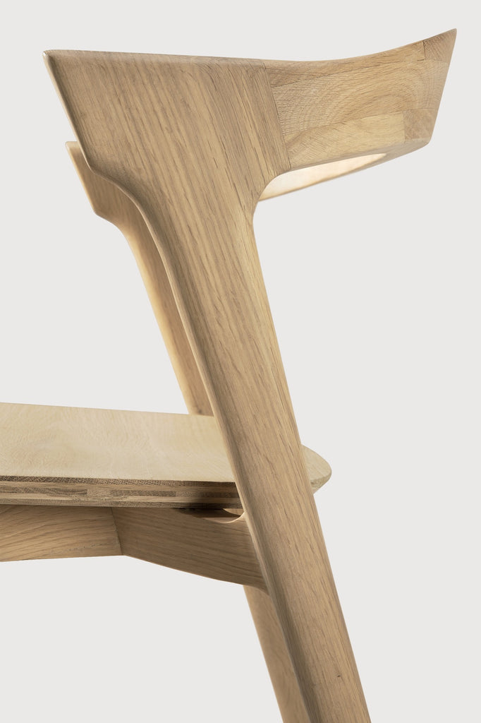 White Oak Bok Dining Chair detail with white background and beautiful wood joinery. - Saffron and Poe, Ethnicraft