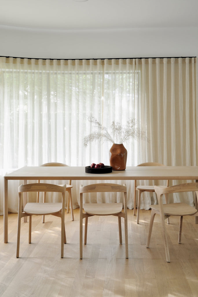 Oak Bok Dining Chairs Modern bright dining room with sheer curtains and oak floors. - Saffron and Poe, Ethnicraft