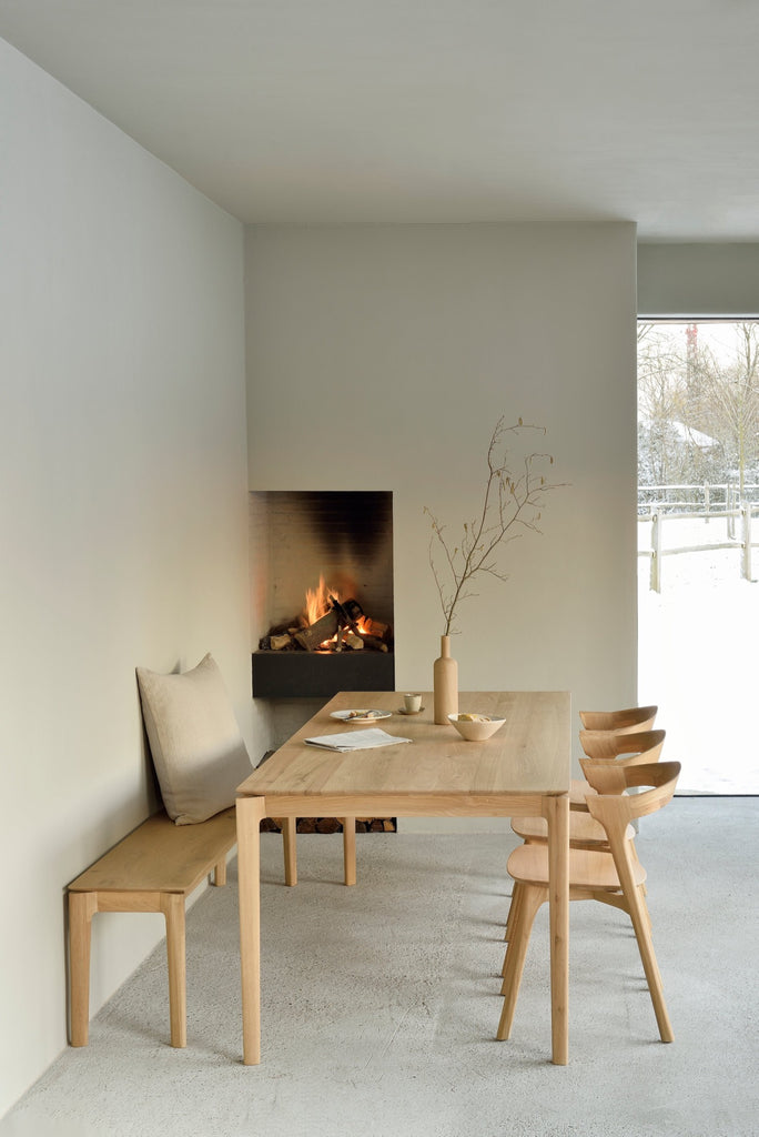 Teak Bok Dining Chairs and Table in Plastered Modern European inspired dining room with fireplace. - Saffron and Poe, Ethnicraft