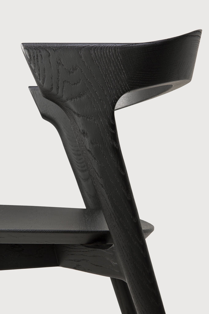 Black Oak Bok Dining Chair detail with white background and beautiful wood grain. - Saffron and Poe, Ethnicraft