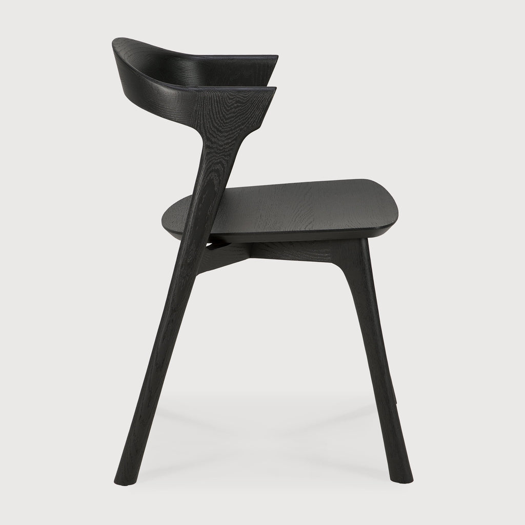 Black Oak Bok Dining Chair side view with white background and beautiful wood grain. - Saffron and Poe, Ethnicraft