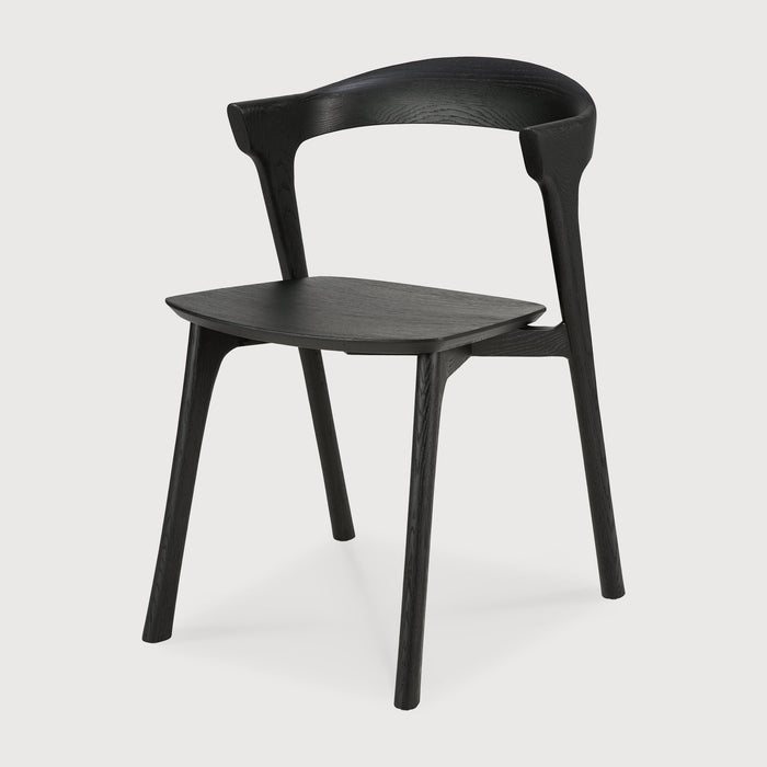 Black Oak Bok Dining Chair angle view with white background and beautiful wood joinery. - Saffron and Poe, Ethnicraft