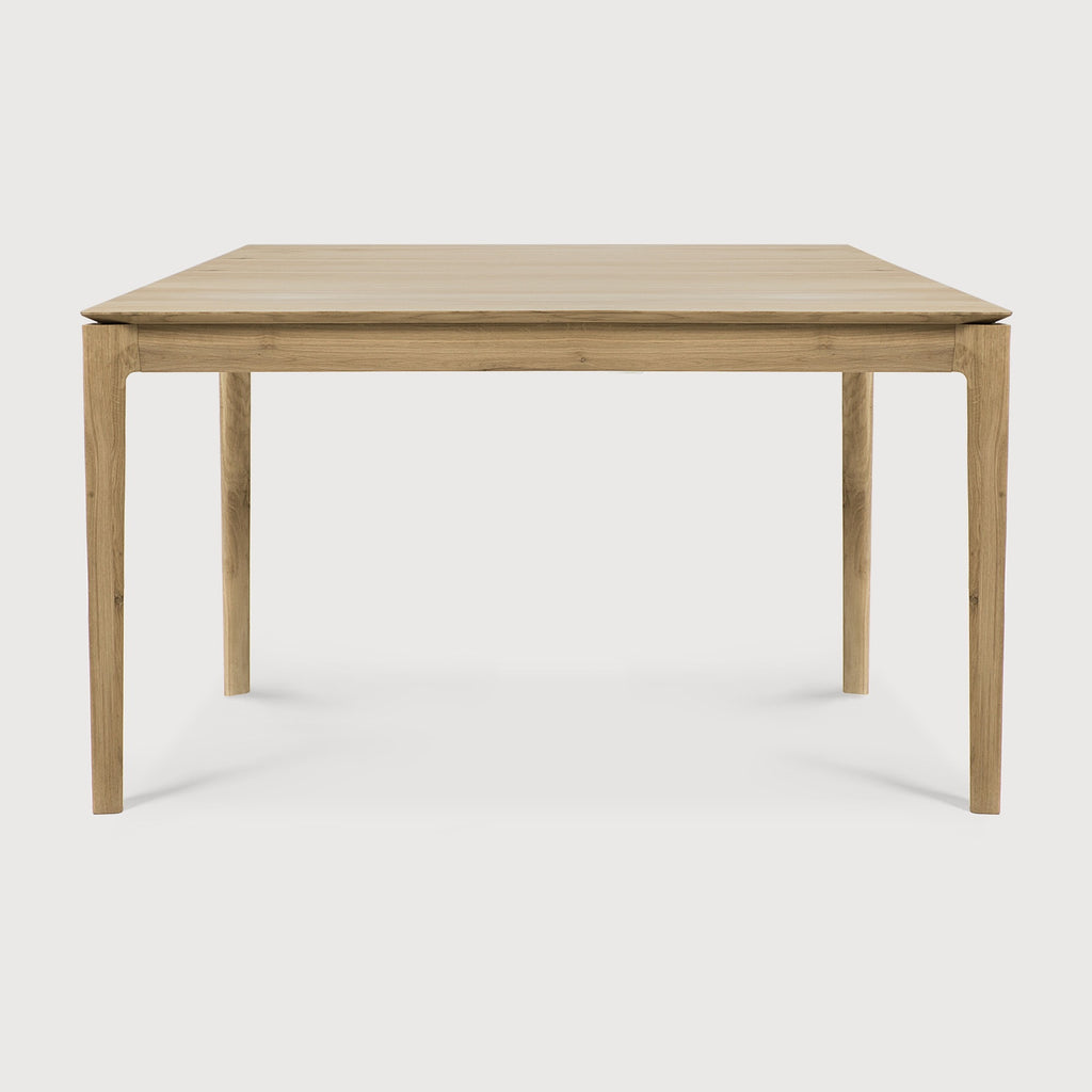 Small White Oak Bok Dining Table side view with white background, featuring floating table top and beautiful wood joinery. - Saffron and Poe, Ethnicraft