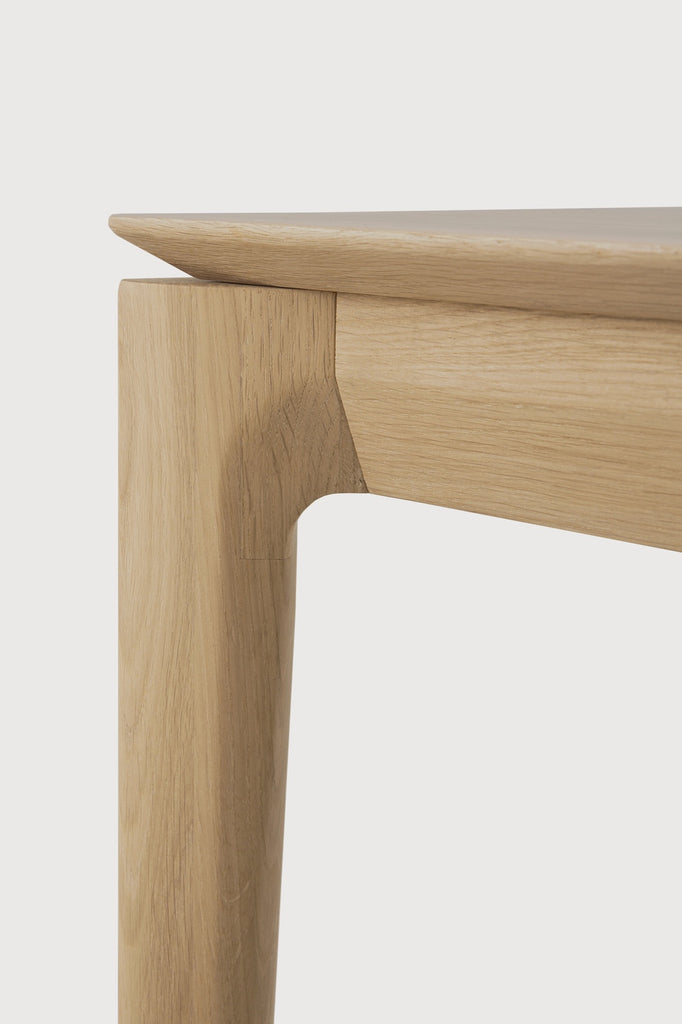White Oak Bok Bench detail with white background and beautiful wood joinery. - Saffron and Poe, Ethnicraft