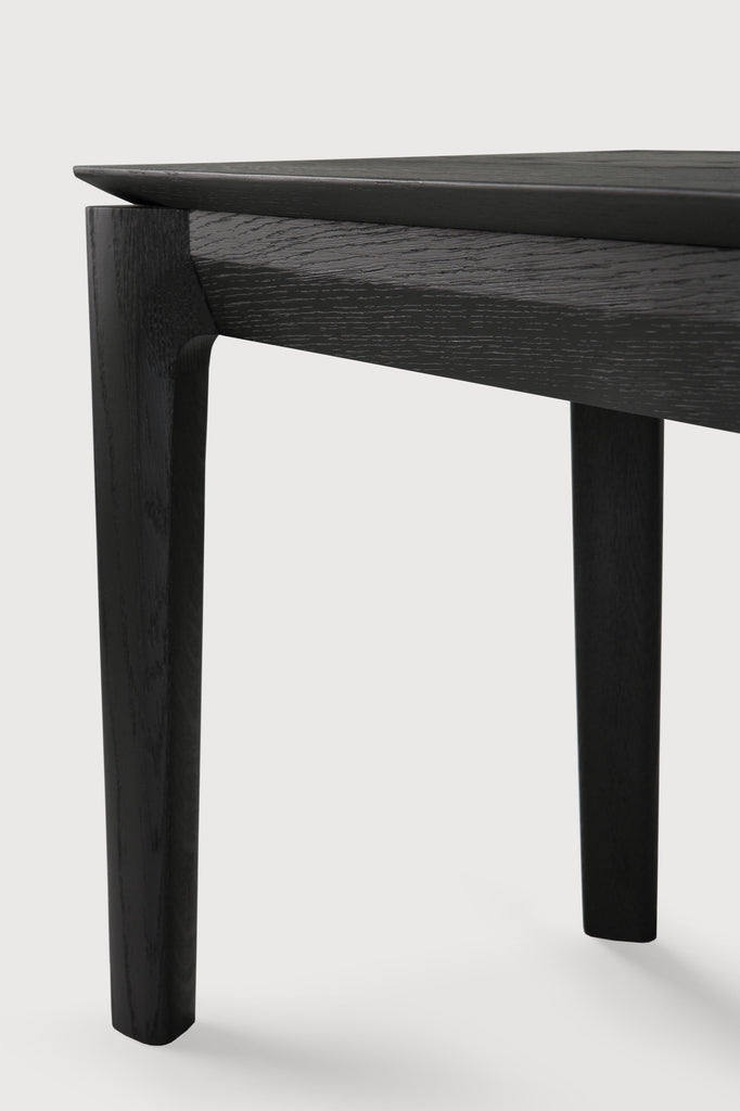 Black Oak Bok Bench detail with white background and beautiful wood joinery. - Saffron and Poe, Ethnicraft