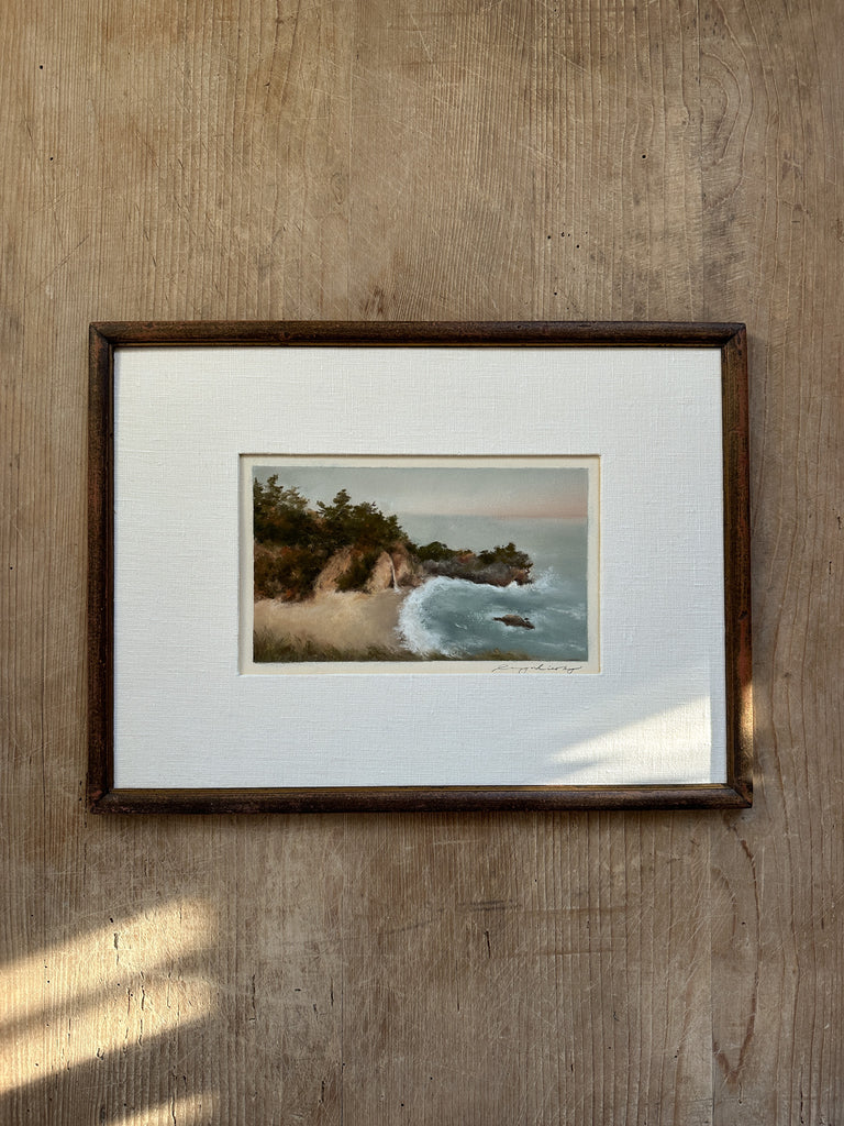 Big Sure water fall pastel artwork in white linen matting and vintage framing on table. - Saffron and Poe, Lina Gordievsky