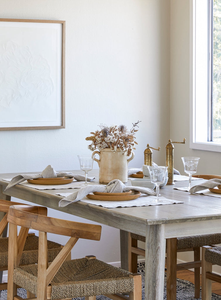 Italian Confit Pot Styled on dining table with place settings and woven wishbone chairs. - Saffron and Poe