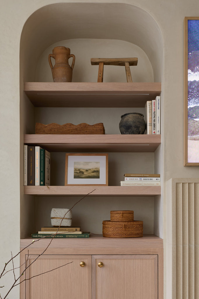 Styled shelving niche with antique clay pot
