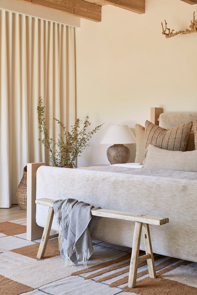 Styled view of Antique Chinese Bench - No. 09 in a neutral bedroom with a Sculptural Nest Basket. - Saffron and Poe