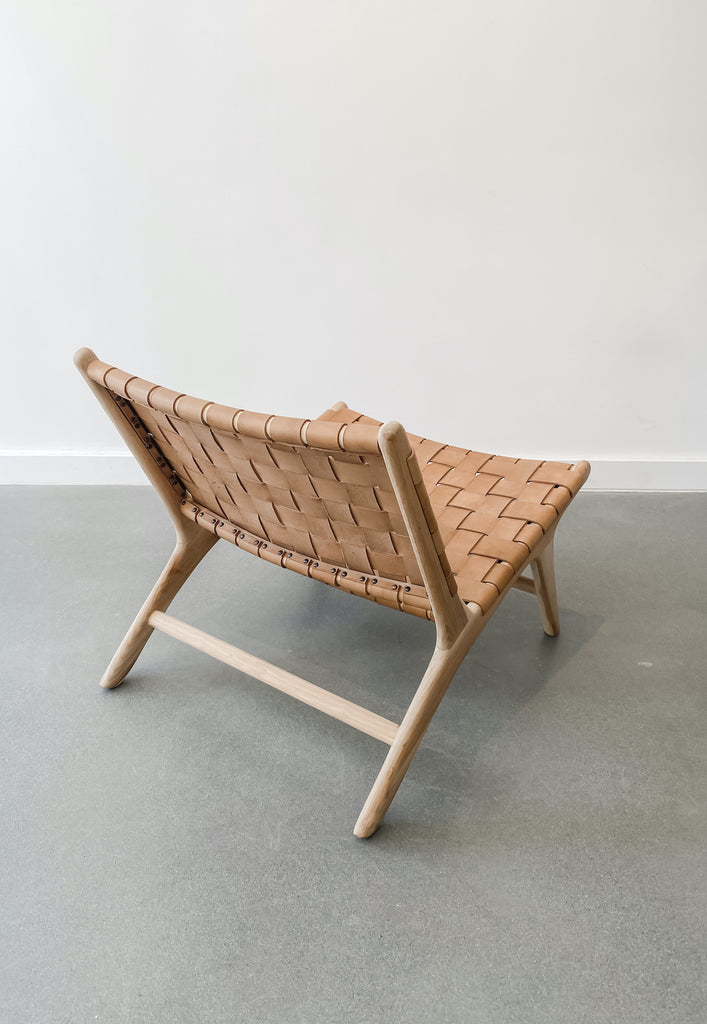 Back view of Woven Leather Strap Lounge Chair in Beige against white background. Teak wood and leather straps. Handcrafted in Bali. - Saffron and Poe