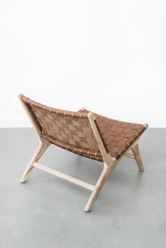 Side angle view of our Woven Leather Strap Lounge Chair - Saddle. Handmade in Bali with Teak wood and vegetable-tanned leather imported from Java. - Saffron and Poe