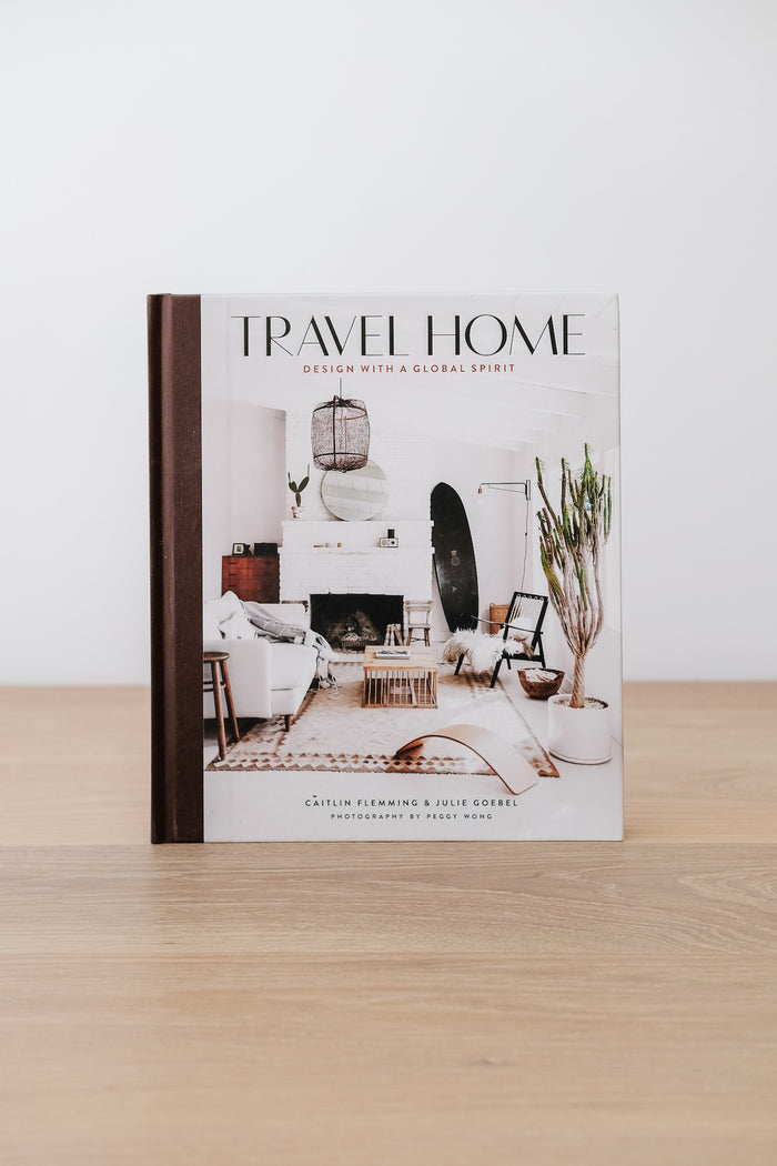 Front view of Travel Home: Design with a Global Spirit against a white wall - Saffron and Poe