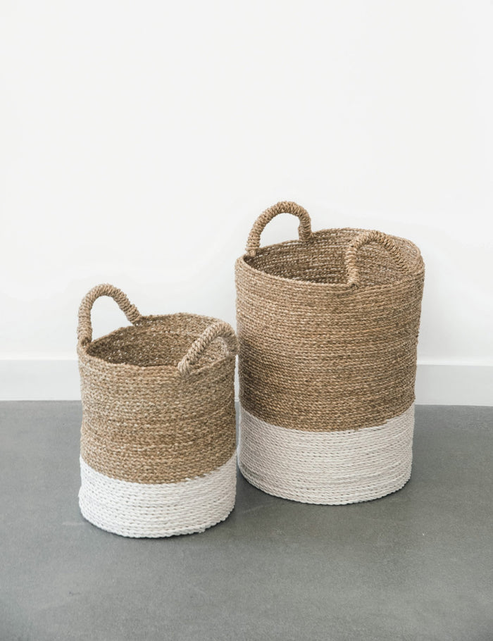 Two cream-colored with white base Structured Hyacinth storage baskets with handles. Handmade in Bali using natural water hyacinth  - Saffron and Poe