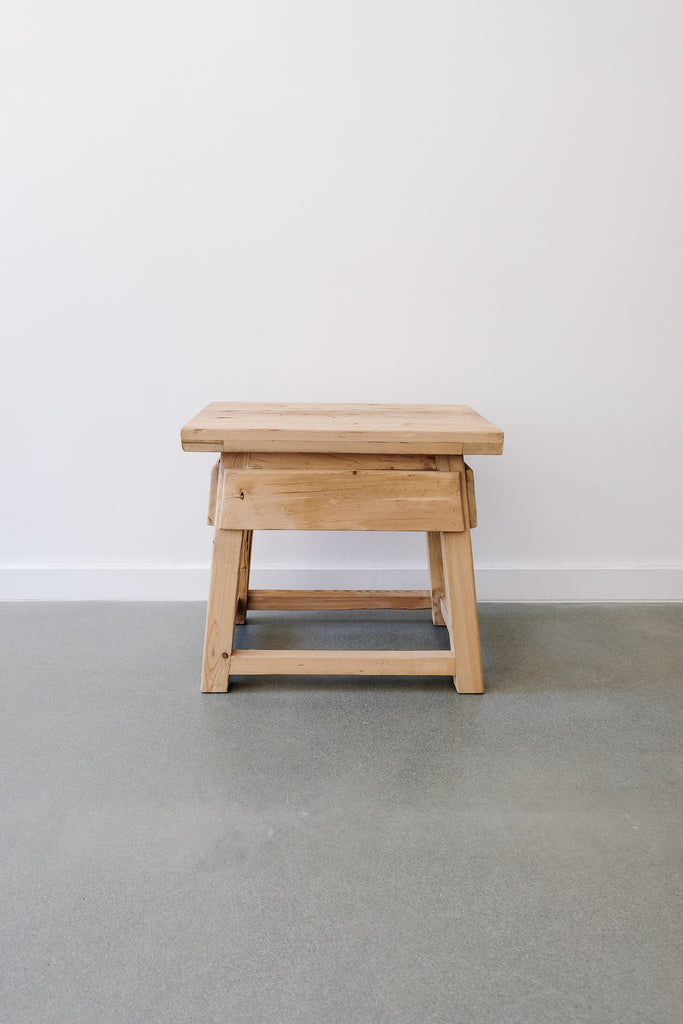 Front view of Vintage Cedar End Table against a white wall. - Saffron + Poe