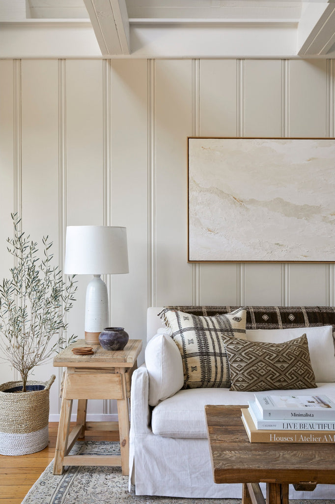 Styled Antique Clay Pot on a Vintage Cedar Side Table with a Hand Thrown Ceramic Lamp, a Linen Sofa, and some Bhujodi textiles. - Saffron and Poe
