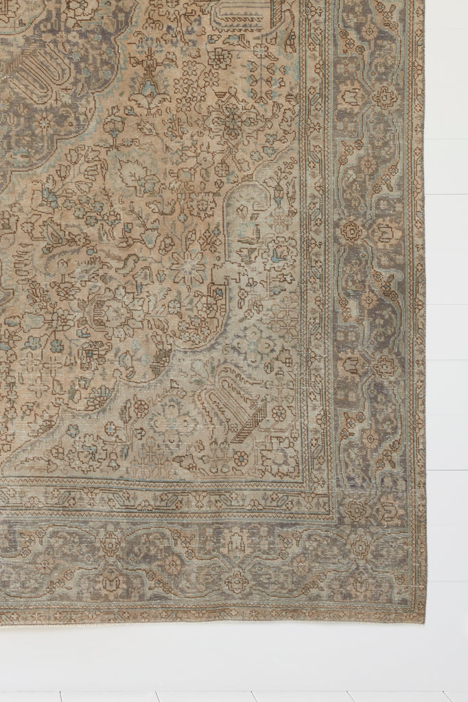 Close up view of No. 11 - Vintage Turkish Oushak Rug against a white background. - Saffron and Poe