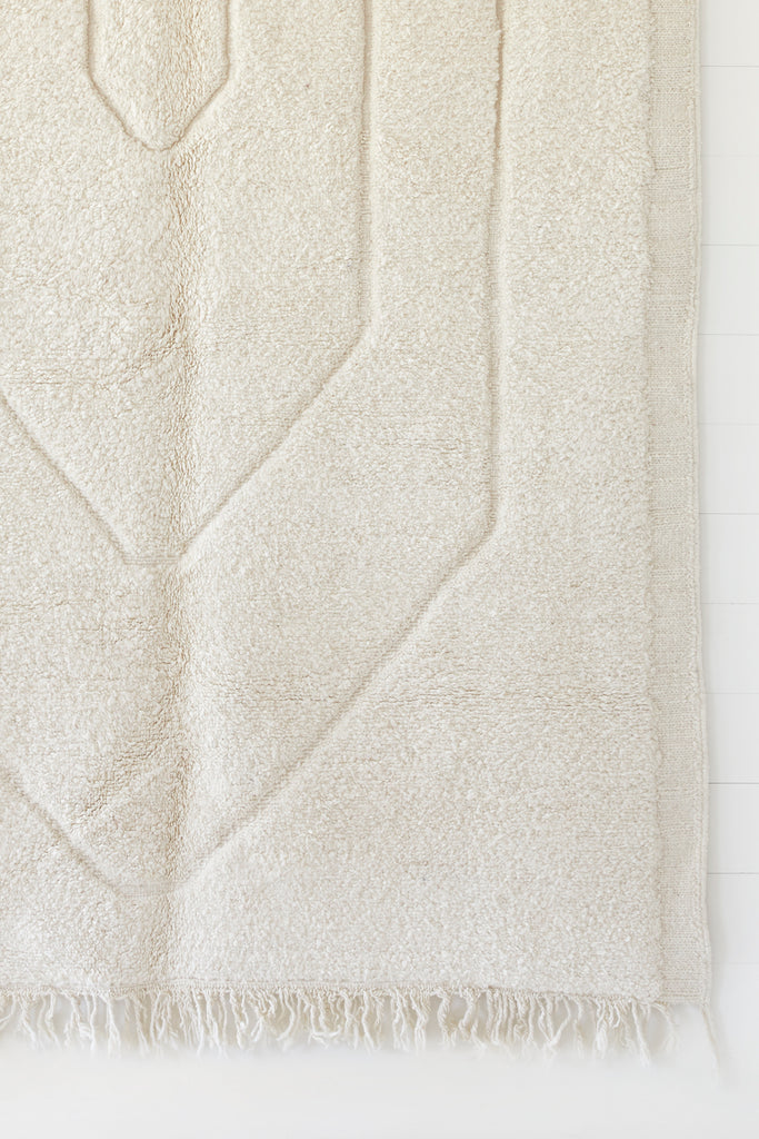 Close up view of No. 19 - Beni Ourain Rug against a white background. - Saffron and Poe