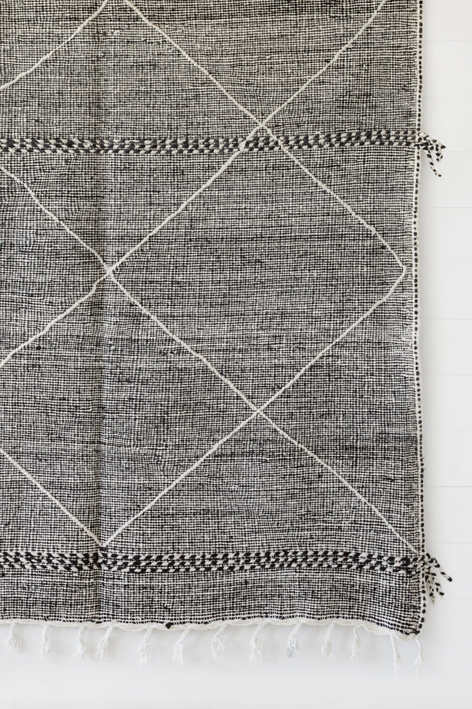 Close up view of No. 30 - Moroccan Flat Weave Kilim Rug against a white background. - Saffron and Poe
