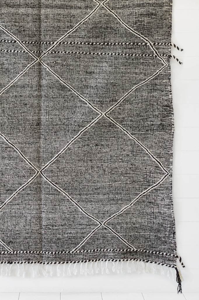 Close up view of No. 32 - Moroccan Flat Weave Kilim Rug against a white background. - Saffron and Poe