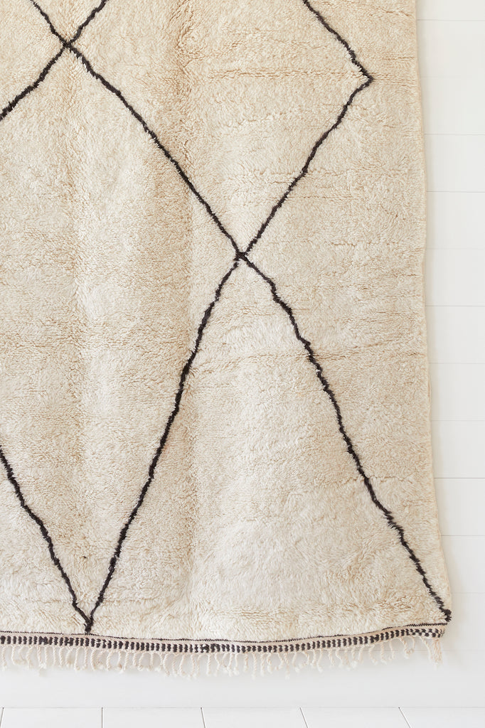 Close up view of No. 03 - Beni Ourain Rug against a white background. - Saffron and Poe