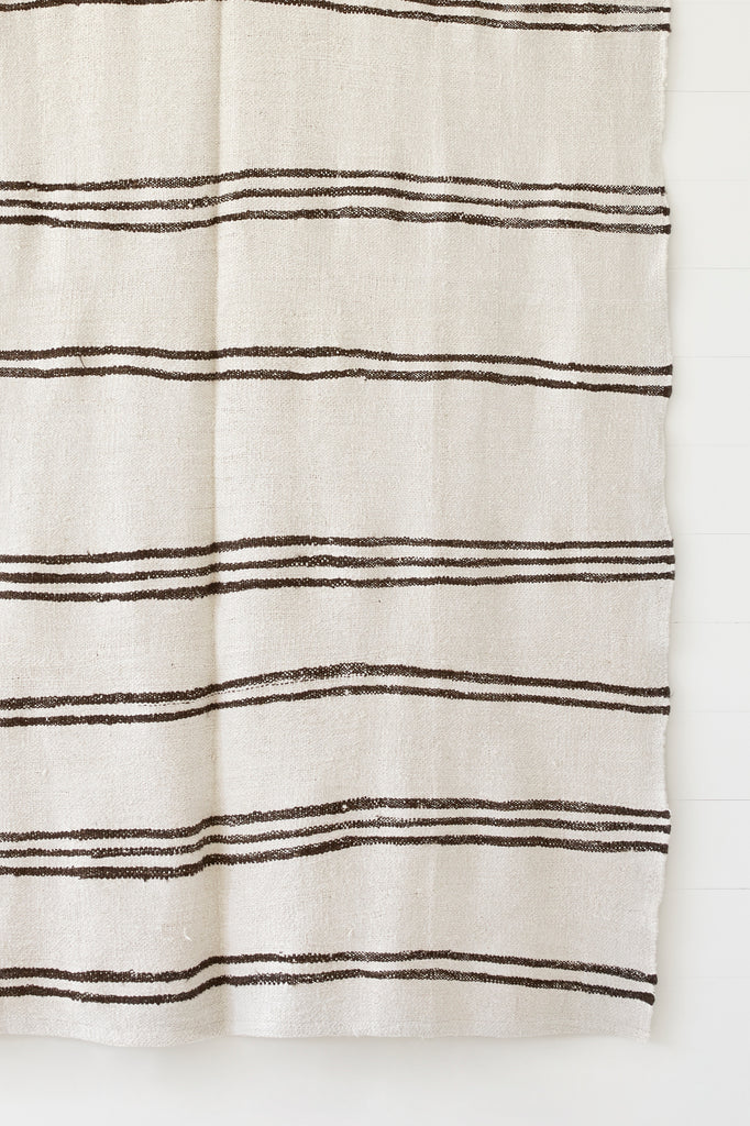 Close up view of No. 50 - Turkish Kilim Rug against a white background. - Saffron and Poe