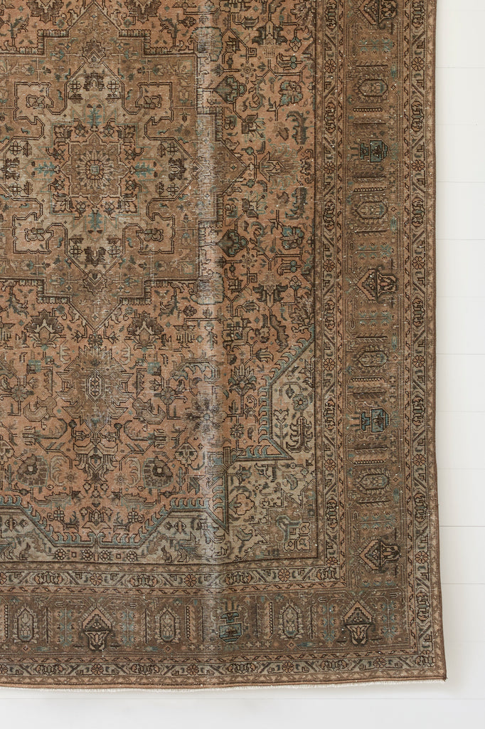 Close up view of No. 58 - Vintage Turkish Oushak Rug against a white background. - Saffron and Poe