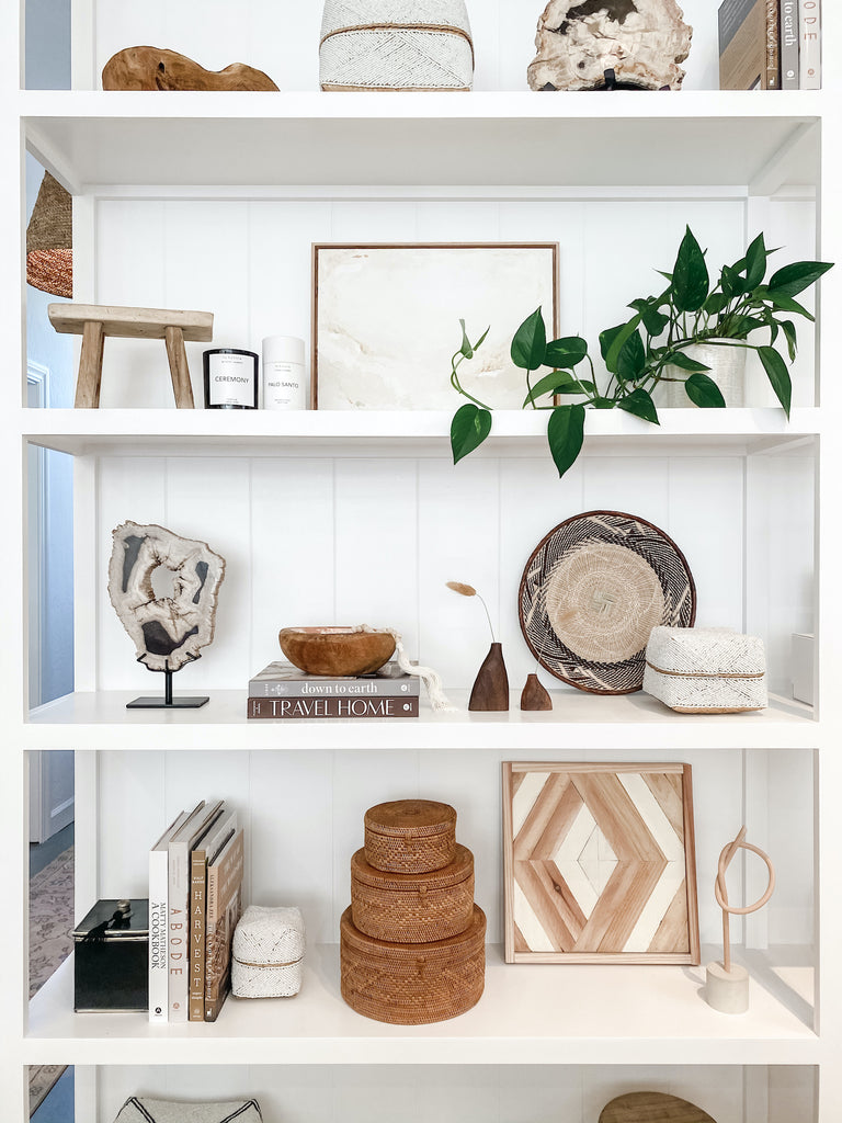 Styled Hand Beaded Bali Basket - Solid White on a shelf with traveled accessories. - Saffron and Poe