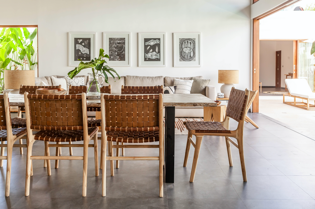 Open living room and kitchen table styled with Woven Leather Strap Dining Chair - Saddle. Handmade in Bali with Teak wood and vegetable-tanned leather imported from Java. - Saffron and Poe
