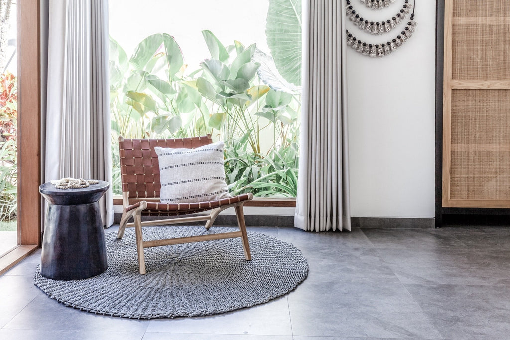 Woven Leather Strap Lounge Chair - Saddle styled in living room with rug and table. Handmade in Bali with Teak wood and vegetable-tanned leather imported from Java. - Saffron and Poe