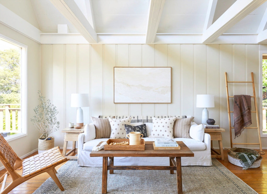 coffee table made from vintage reclaimed wood styled in a neutral toned living room