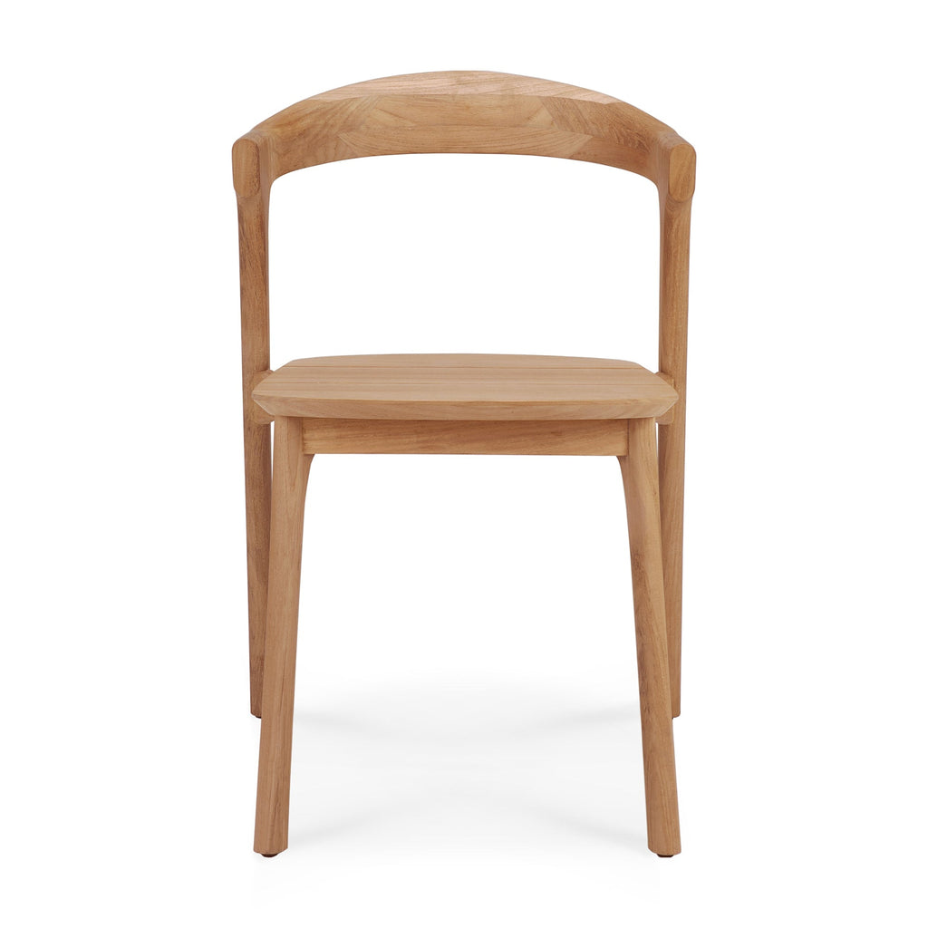 Bok Outdoor Dining Chair in solid teak with neutral fabric cushion and airy sculptural design