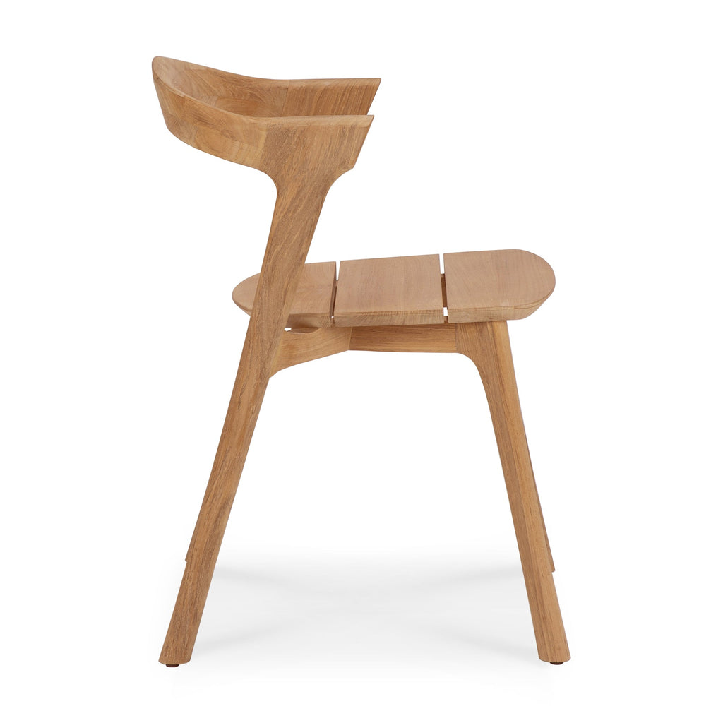 Bok Outdoor Dining Chair made of solid teak with fabric cushion and sculptural design